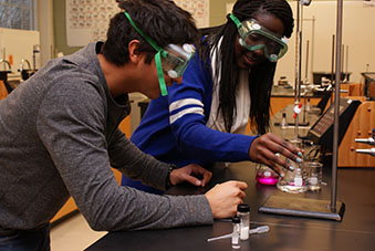 A random collection of images that changes on each page load. Some images are lab equipment, some are students performing a lab, and some are students submitting their lab results online at chem21Labs.com.